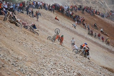 dragging their bikes uphill dragging their bikes uphill